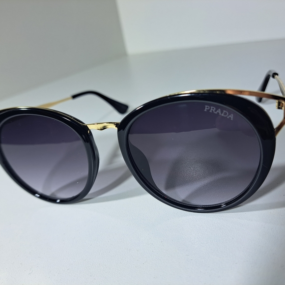 Prada Accessories - Prada Black Frame Sunglasses with Gold Temple Accents